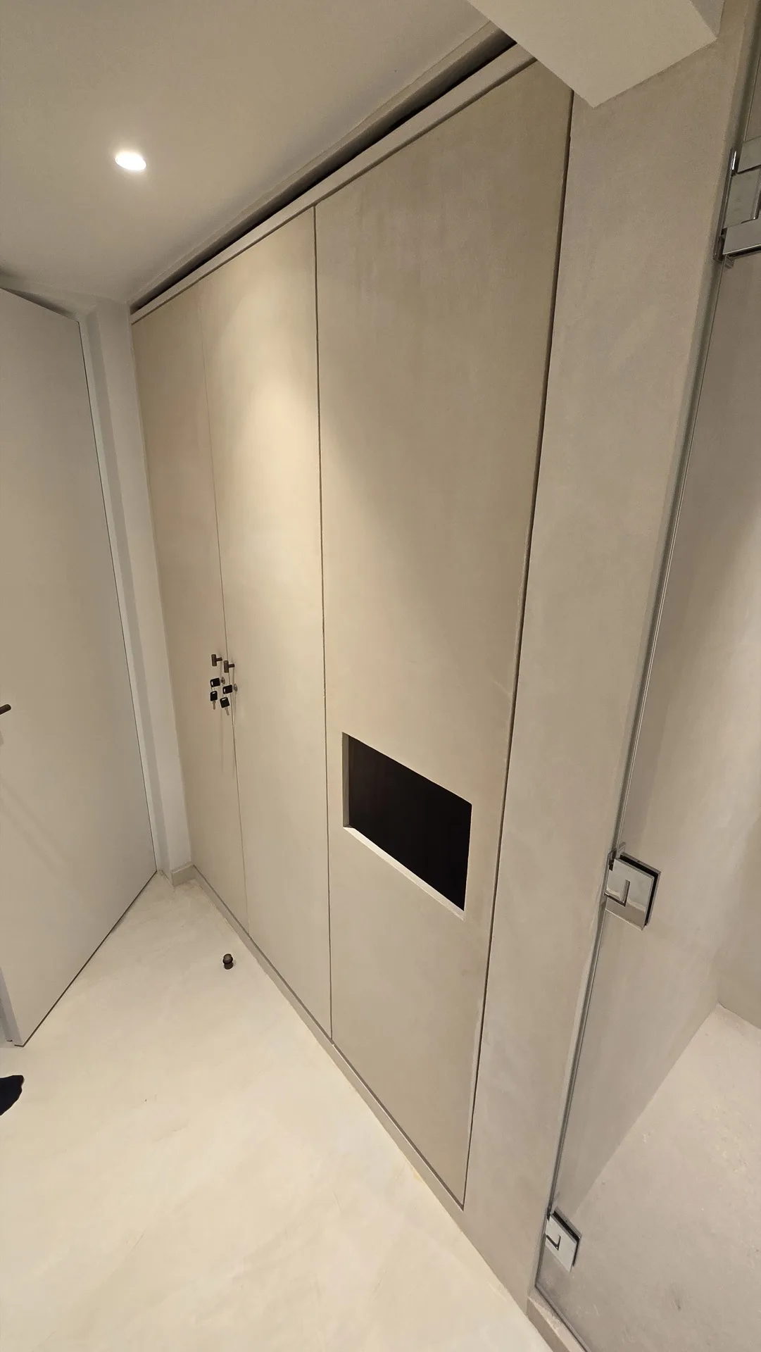 Spa treatment room integrated wardrobes and vanity — luxury hospitality joinery
